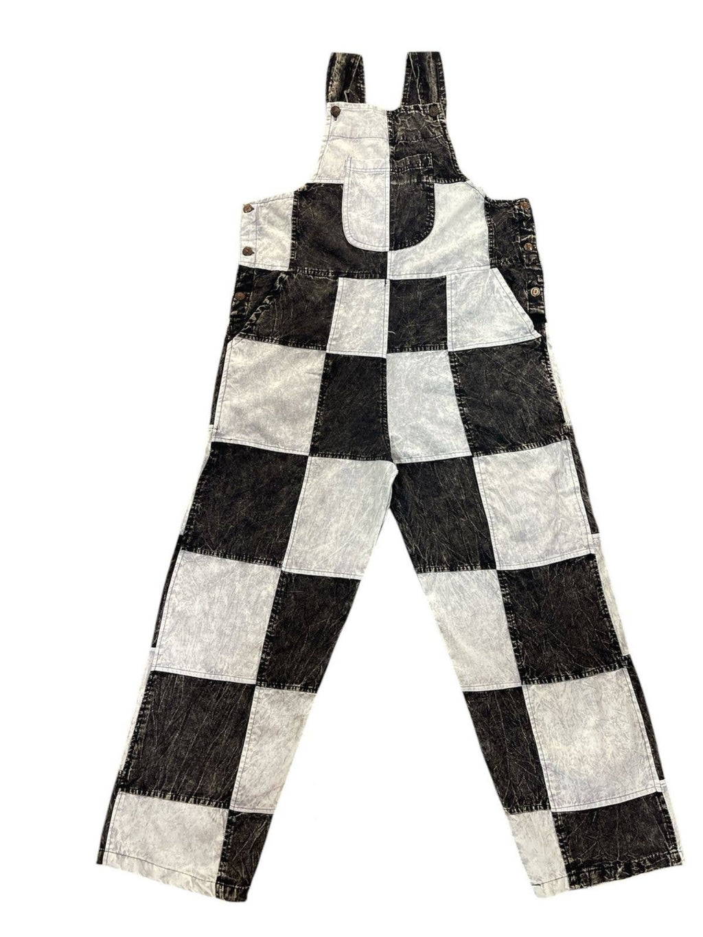 A pair of cotton overalls with a black and white checkerboard pattern, laid flat against a white background.